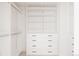 Organized walk-in closet with custom shelving and drawers for optimal storage at 3130 Wyandot St, Denver, CO 80211