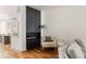 Stylish living room with a modern fireplace, hardwood floors, and comfortable seating at 3130 Wyandot St, Denver, CO 80211