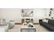 Living room featuring neutral tones, contemporary furniture, and a stylish marble coffee table at 3130 Wyandot St, Denver, CO 80211