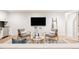 Cozy living room featuring modern decor and a large flat screen television at 3130 Wyandot St, Denver, CO 80211