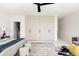 Primary suite featuring a large closet, neutral decor and modern ceiling fan at 3130 Wyandot St, Denver, CO 80211