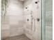 Luxurious shower featuring dual shower heads and sleek tile work at 3130 Wyandot St, Denver, CO 80211