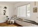 Cozy sitting area with a window seat, custom cabinetry, and lots of natural light at 3130 Wyandot St, Denver, CO 80211