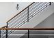 Modern staircase with wood and metal railings, and white walls at 3130 Wyandot St, Denver, CO 80211