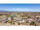 Picturesque aerial view featuring the neighborhood's pond, greenery and stunning mountain views at 10704 Flowerburst Ct, Highlands Ranch, CO 80126