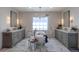 Luxurious bathroom featuring a soaking tub, dual vanities, and marble flooring at 10704 Flowerburst Ct, Highlands Ranch, CO 80126