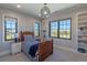 Bright bedroom with mountain views, built-in shelves, and a comfortable bed at 10704 Flowerburst Ct, Highlands Ranch, CO 80126