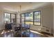 Sun-filled dining area with windows offering backyard views at 10704 Flowerburst Ct, Highlands Ranch, CO 80126