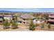Beautiful suburban home featuring a nicely landscaped yard, and a view of the mountains in the distance at 10704 Flowerburst Ct, Highlands Ranch, CO 80126