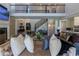 Spacious living room showcasing a large fireplace, modern decor, and a view of the open staircase at 10704 Flowerburst Ct, Highlands Ranch, CO 80126