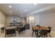 Large recreation room with space for a ping pong table, living area, and dining space at 10704 Flowerburst Ct, Highlands Ranch, CO 80126