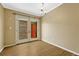 Bright dining room with wood floors and patio doors leading to a cozy brick-wall patio at 7729 S Cove Cir, Centennial, CO 80122