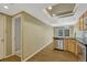Open kitchen featuring stainless dishwasher, wood cabinets, granite countertops, and wood flooring at 7729 S Cove Cir, Centennial, CO 80122