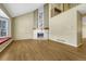 Bright living room boasts a fireplace, hardwood floors, and tall ceilings at 7729 S Cove Cir, Centennial, CO 80122