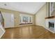 Bright living room with tall windows, fireplace, and hardwood floors at 7729 S Cove Cir, Centennial, CO 80122