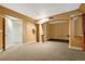 Cozy living room featuring neutral paint, carpet, and well-placed sconces, perfect for relaxing or entertaining at 7729 S Cove Cir, Centennial, CO 80122