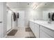 Bathroom features double sinks, a walk-in shower, and tile flooring at 9334 Sedalia St, Commerce City, CO 80022