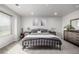 Bedroom features a black iron bed frame, neutral walls and carpeting at 9334 Sedalia St, Commerce City, CO 80022