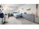 Cozy bedroom decorated with space and outdoor themes, featuring a large dresser at 9334 Sedalia St, Commerce City, CO 80022
