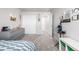 This carpeted bedroom features neutral paint, a large closet and fun decor at 9334 Sedalia St, Commerce City, CO 80022