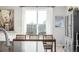 Dining area next to a large window providing natural light at 9334 Sedalia St, Commerce City, CO 80022