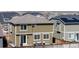 Exterior view of the back of the home highlighting the fenced yard and patio with seating at 9334 Sedalia St, Commerce City, CO 80022