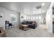 Comfortable living area with neutral walls, carpeting, and lots of natural light at 9334 Sedalia St, Commerce City, CO 80022
