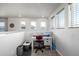 Functional upper hallway desk and workspace area featuring three windows for natural light and productivity at 9334 Sedalia St, Commerce City, CO 80022