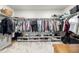 Well-organized walk-in closet with ample hanging and shelving space at 9334 Sedalia St, Commerce City, CO 80022