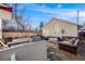 Spacious backyard with outdoor seating, a grill, and a privacy fence at 2047 S Franklin St, Denver, CO 80210