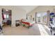 Bright bedroom with vaulted ceilings, access to an outdoor deck, and neutral decor at 2047 S Franklin St, Denver, CO 80210