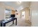 Hallway with a desk, shelving, and view into bedroom with bed at 2047 S Franklin St, Denver, CO 80210