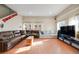 Spacious living room with hardwood floors, multiple seating options, and ample natural light at 2047 S Franklin St, Denver, CO 80210