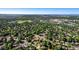 Scenic aerial view of a verdant neighborhood with mature trees and the city skyline in the distance at 2931 S Sidney Ct, Denver, CO 80231