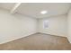 Spacious basement area with neutral carpet, a window for natural light, and a clean, unfinished feel at 2931 S Sidney Ct, Denver, CO 80231