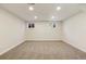 Large basement featuring carpeted floors and multiple windows that offer natural light, creating an inviting space at 2931 S Sidney Ct, Denver, CO 80231