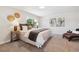 Comfortable bedroom with a large window, cozy bedding, and modern decor at 2931 S Sidney Ct, Denver, CO 80231