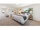 Bright bedroom with a large window, neutral colors, and stylish side tables at 2931 S Sidney Ct, Denver, CO 80231