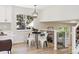 Cozy dining area with a modern light fixture and plenty of natural light at 2931 S Sidney Ct, Denver, CO 80231