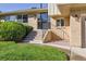 Close up of the front entrance with brick work and well maintained lawn at 2931 S Sidney Ct, Denver, CO 80231