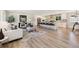 Open concept living room with a large island and bar stool seating at 2931 S Sidney Ct, Denver, CO 80231
