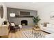 Inviting living room showcases a gray brick fireplace and a comfortable seating area with natural light at 2931 S Sidney Ct, Denver, CO 80231