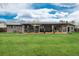 Expansive backyard featuring a covered patio with ample seating, perfect for gatherings and enjoying the outdoors at 8151 S Marshall Ct, Littleton, CO 80128