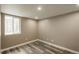 Cozy bedroom with a window well and neutral-toned walls at 8151 S Marshall Ct, Littleton, CO 80128