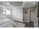 Bright bedroom with large closets, light gray walls, and neutral-colored carpeting at 8151 S Marshall Ct, Littleton, CO 80128