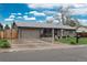 Charming single-story home with inviting curb appeal, landscaped front yard, and a two-car garage at 8151 S Marshall Ct, Littleton, CO 80128