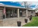 Charming single-story home featuring a covered front porch with rocking chairs and professional landscaping at 8151 S Marshall Ct, Littleton, CO 80128