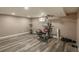 Home gym featuring stationary bike, weight-lifting machine, and neutral-colored walls at 8151 S Marshall Ct, Littleton, CO 80128