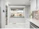 Bright kitchen with white cabinets, a window bench and stainless steel appliances at 8151 S Marshall Ct, Littleton, CO 80128