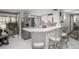 Modern kitchen with stainless steel appliances, breakfast bar and stylish seating at 8151 S Marshall Ct, Littleton, CO 80128